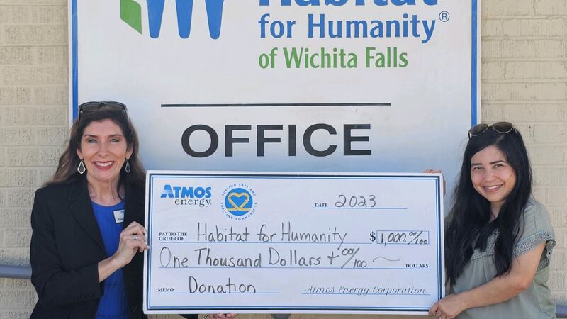 Atmos Energy presents check to Habitat for Humanity
