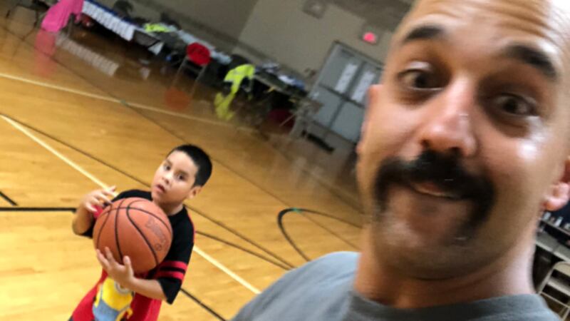 Moose Mustafa made time to play with some children at a shelter after a long day assisting in...