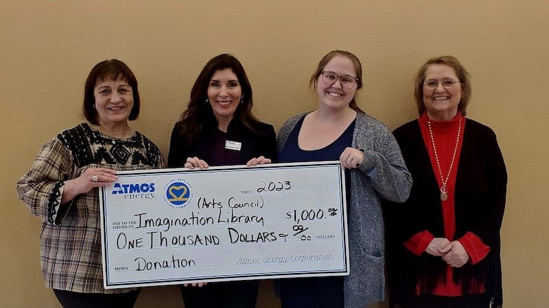 Atmos Energy donates $1000 to the Arts Council's Imagination Library Program