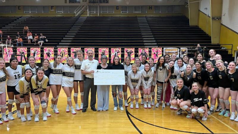 Rider volleyball team presents check for disease research