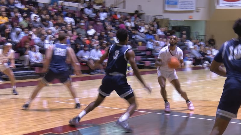 Jermane Carter (15) puts up the jumper.