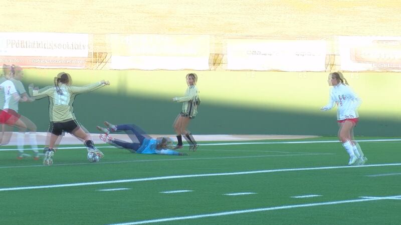 Mia Gilmore knocks in a goal against Northwest Friday night.