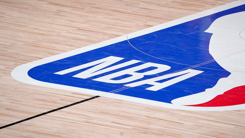 The NBA logo at center court is shown during the second half of an NBA first-round playoff...