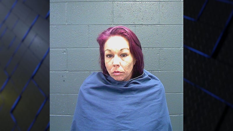 The suspect was taking security tags off of clothes at a department store.